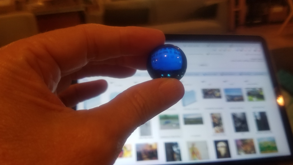 A blue marble with ImageSnippets in the background